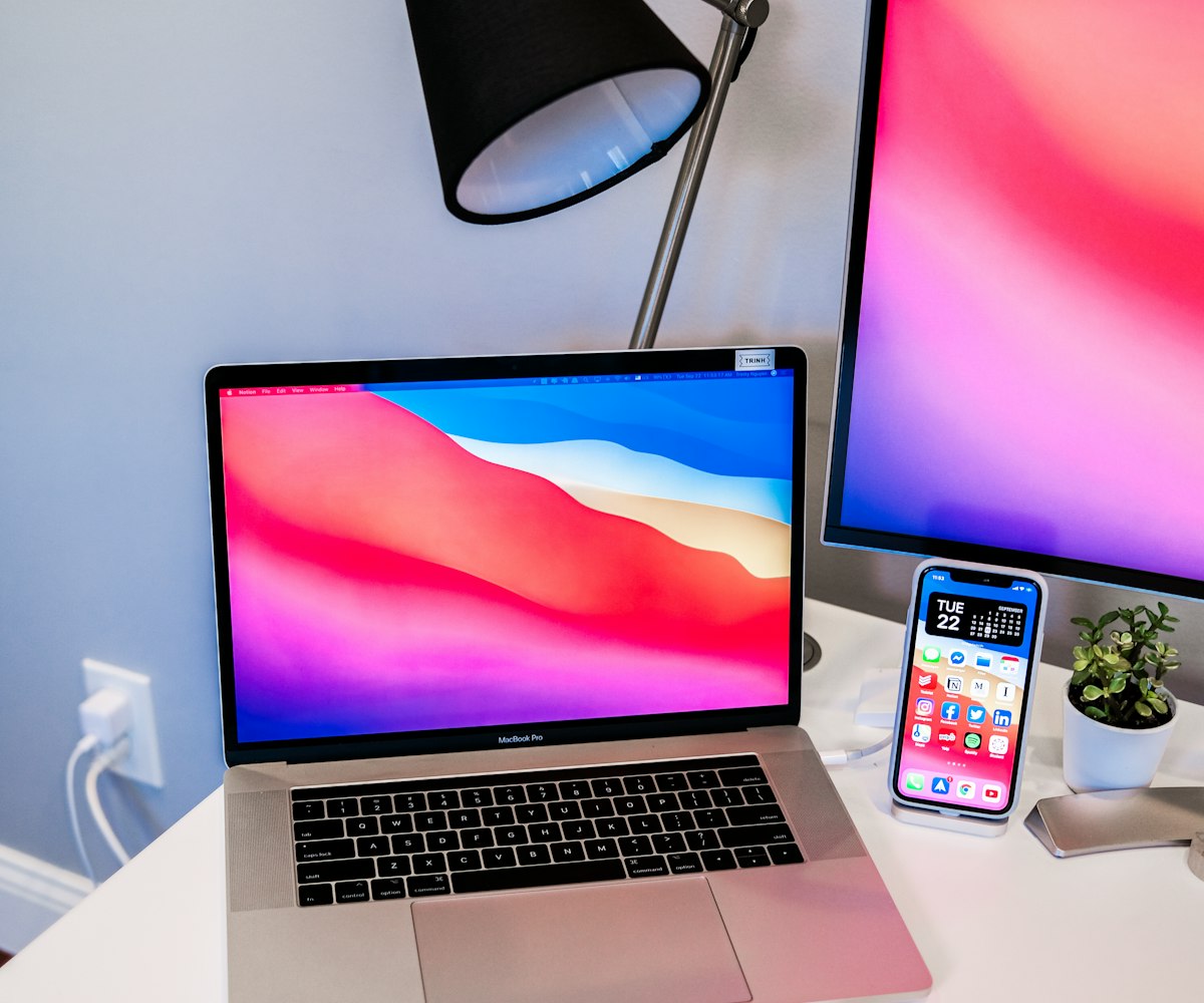MacBook and iPhone on a desk